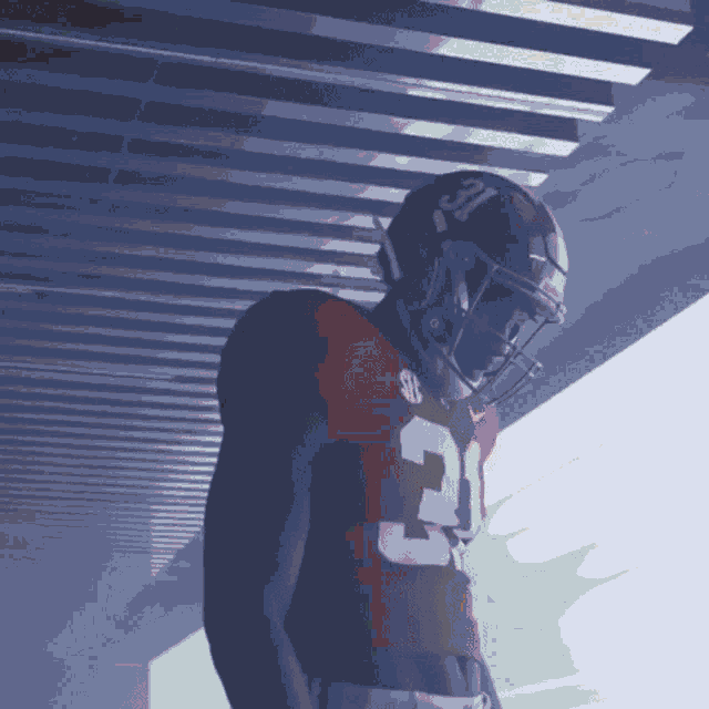 a football player in a red jersey with the number 31 on it