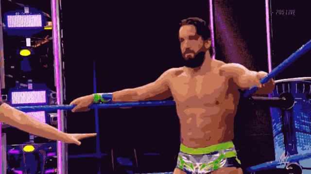 a pixelated image of a wrestler in a ring with 205 live written on the bottom right