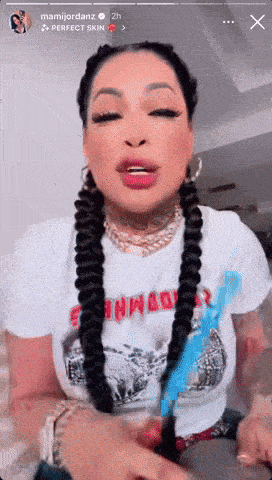 a woman wearing a white shirt that says perfect skin on it