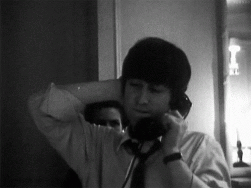 The Beatles John Lennon GIF - The Beatles John Lennon Phone Call GIFs