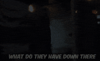 a man standing in front of a wall with the words what do they have down ther