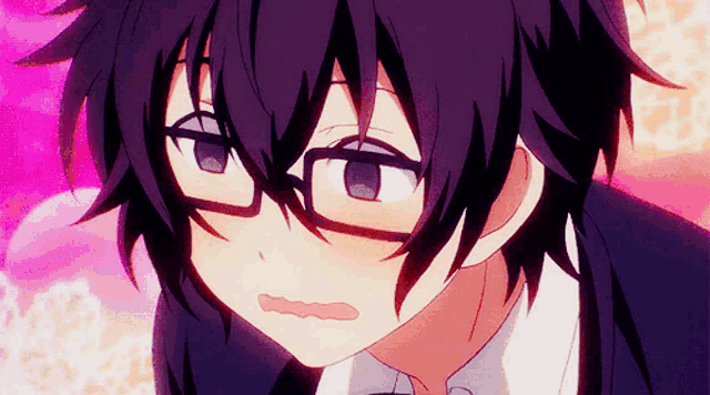 a close up of a person wearing glasses making a face