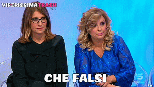 two women sitting next to each other with the words che falsi written on the bottom