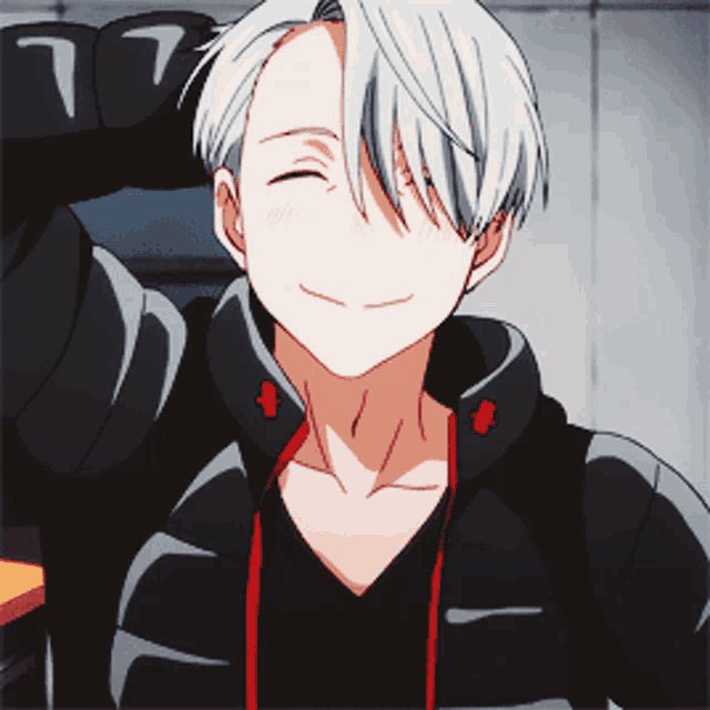 a man with white hair is smiling and wearing a black shirt