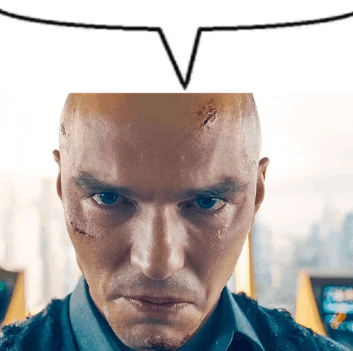 a close up of a man 's face with a v above it