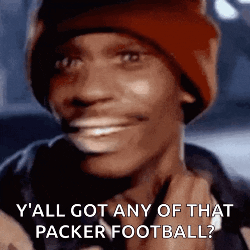 a man wearing a red beanie says y'all got any of that packer football ?