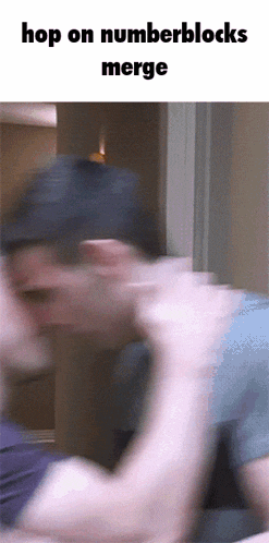 a blurry picture of a man with the words hop on numberblocks merge