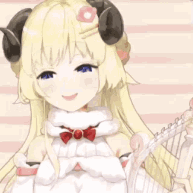 a close up of a girl with horns and a bow on her head .