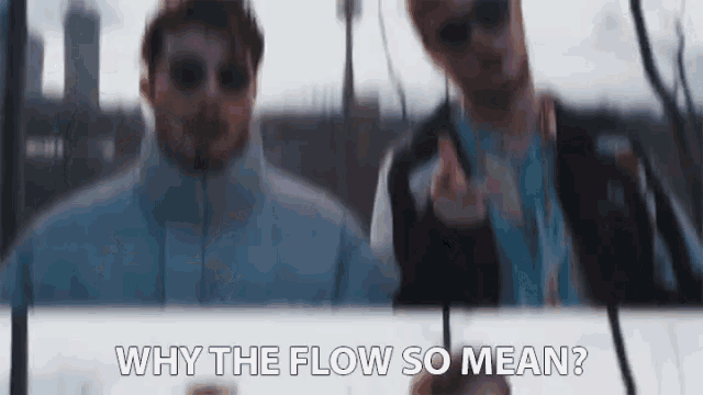 two men are standing next to each other and one of them is asking why the flow so mean ?