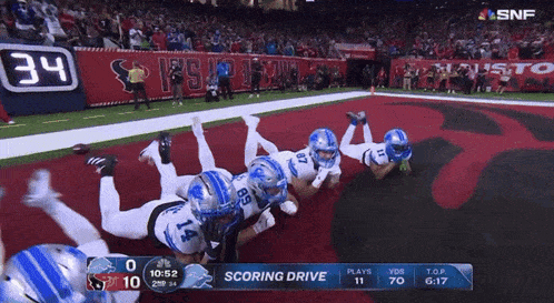 a football game is being played and the score is 34 to 34