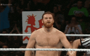 a shirtless wrestler in a wrestling ring with superstars written on the bottom of the screen
