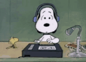 a cartoon of snoopy wearing headphones listening to a tape player