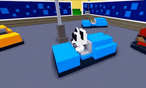a dog is riding a blue bumper car in a room .