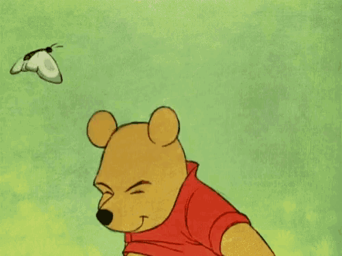 a cartoon of winnie the pooh with a butterfly on his nose .