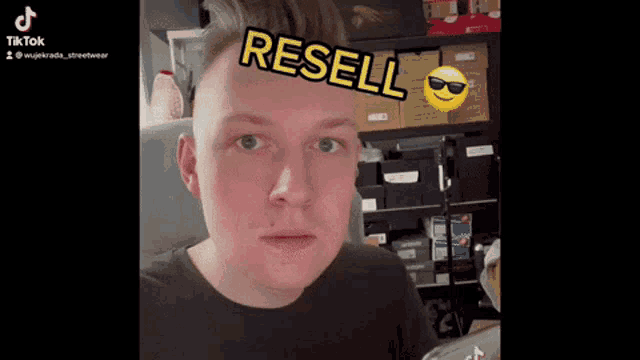 a man with a smiley face and the word resell on his forehead .