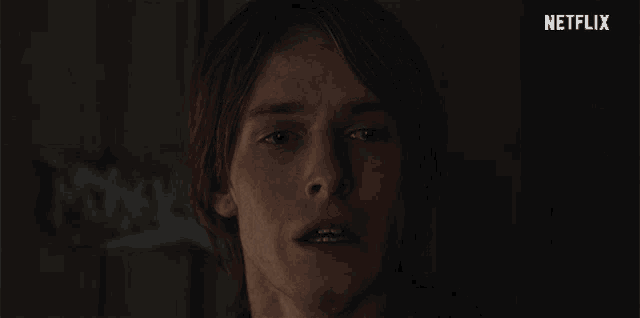 a close up of a man 's face with netflix written in the corner