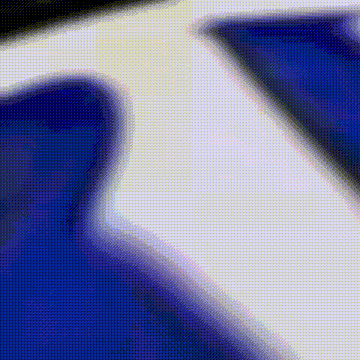 a close up of a blue and white background with a blurred image of a person 's face .