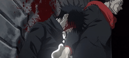 a man in a black jacket is laying on the ground