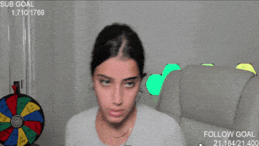 a woman in a grey shirt has a sub goal of 1,710 1769