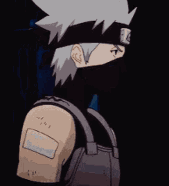 a cartoon character with a bandage on his arm is standing in the dark .