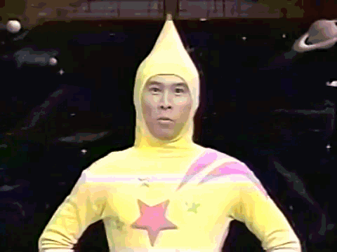 a man in a yellow costume with a pink star on the chest