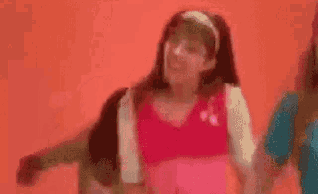 a group of young girls are dancing together in a room .