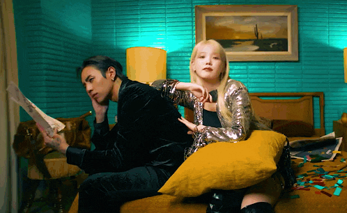 a man and a woman are sitting on a couch