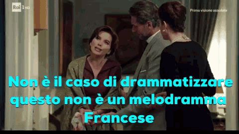 a man and two women are standing next to each other with the words non e il caso di drammatizzare