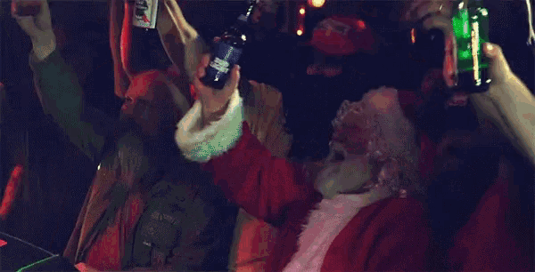 a group of people are holding bottles of beer in their hands .