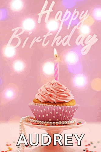 a birthday card for audrey with a pink cupcake with a lit candle