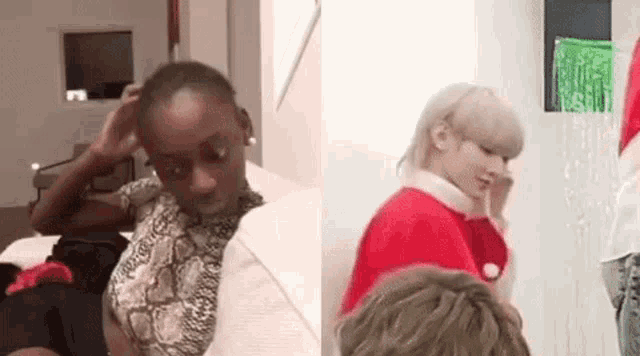 a black woman is sitting on a couch next to a white woman in a santa hat .