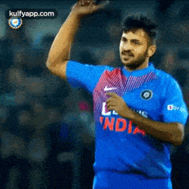 a man in a blue jersey with the word india on it