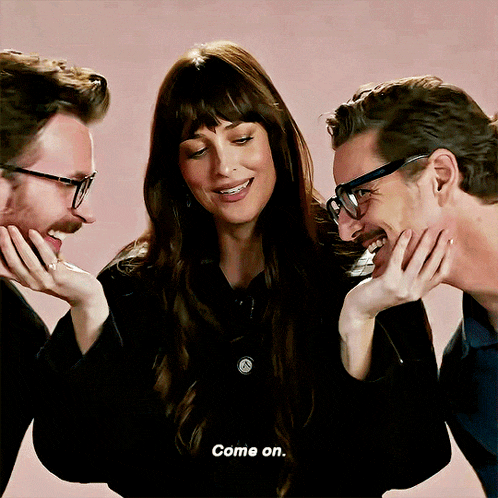 two men and a woman are laughing together and the woman says come on