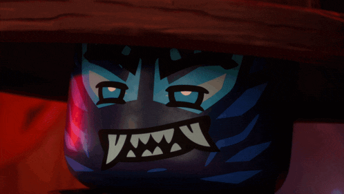 a close up of a cartoon character 's face with sharp teeth
