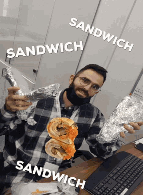 a man in a plaid shirt is holding a sandwich in his hands