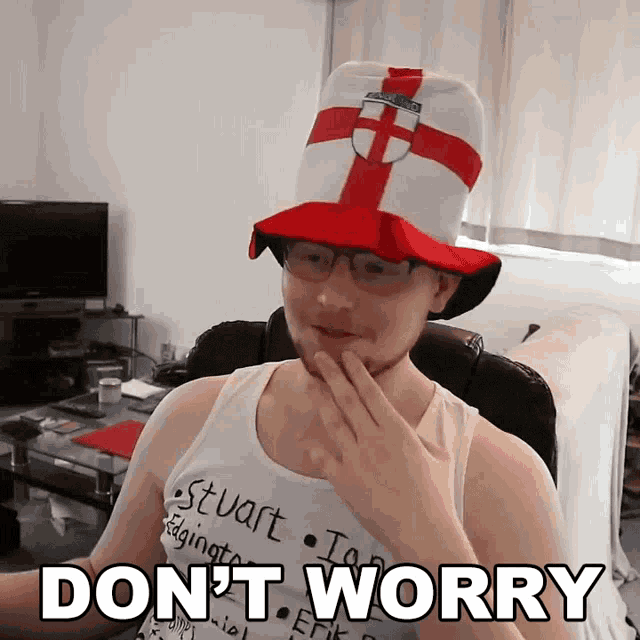 a man wearing a hat and glasses has the words " do n't worry " below him