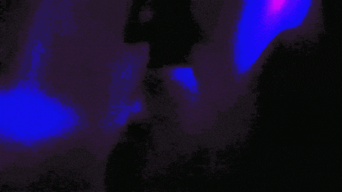 a blue light is shining on a dark background
