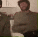 a blurry photo of a man with a beard