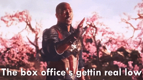 a man in a superhero costume with the words " the box office 's gettin real low " on the bottom