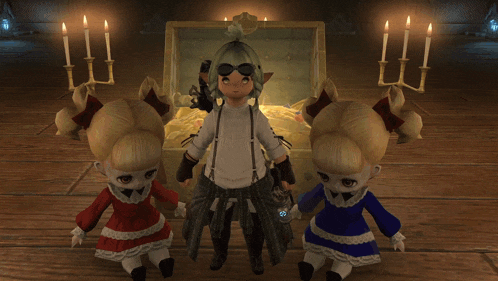 two dolls standing next to a treasure chest with candles in the background