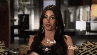 a woman is sitting on a couch with the words dizi episode written on her face