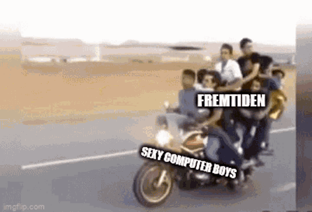 a group of people riding a motorcycle with the words sexy computer boys written on the back