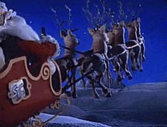 santa claus in a sleigh with reindeer pulling it