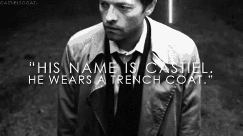a black and white photo of a man wearing a trench coat and tie
