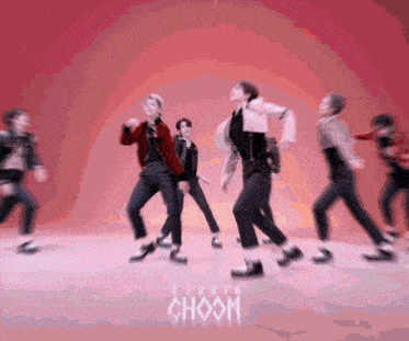 a group of people are dancing in front of a red background that says studio choom on it