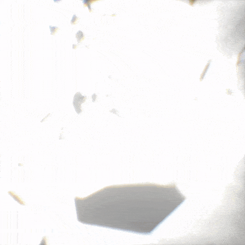 a white background with a few pieces of glass floating in the air