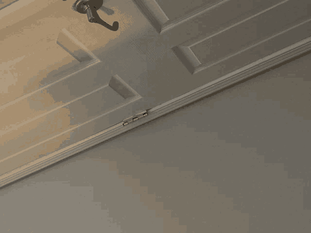 a close up of a door with a hook on the handle