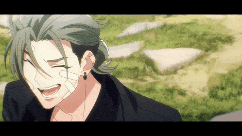 a cartoon character with a bandage on his face is smiling