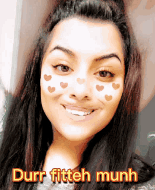 a picture of a woman with hearts on her face and the words durr fitteh munh