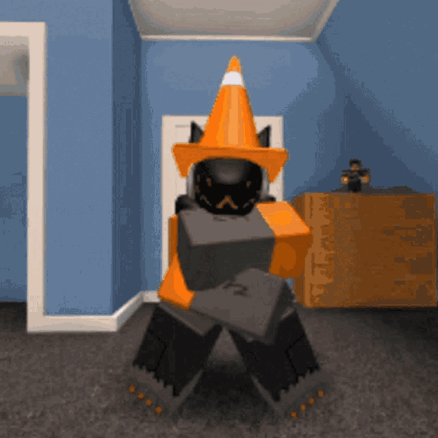 a cartoon character wearing an orange cone hat holds a black box